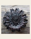 Black Daisy Leather Flower on a warm cream background