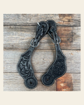 Black Genuine Leather Floral Tooled Spur Straps on a warm cream background
