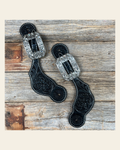 Black Floral Tooled Spur Straps - European Clear Buckles #SS107 on a warm cream background
