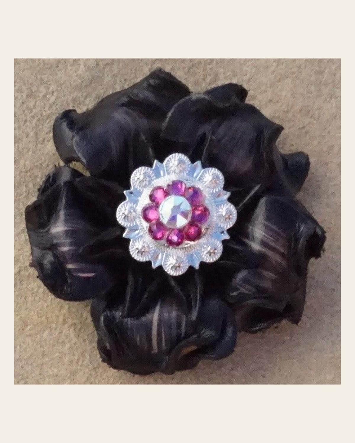 Black Gardenia Flower With Bright Silver Fuchsia and AB 1" Concho on a warm cream background