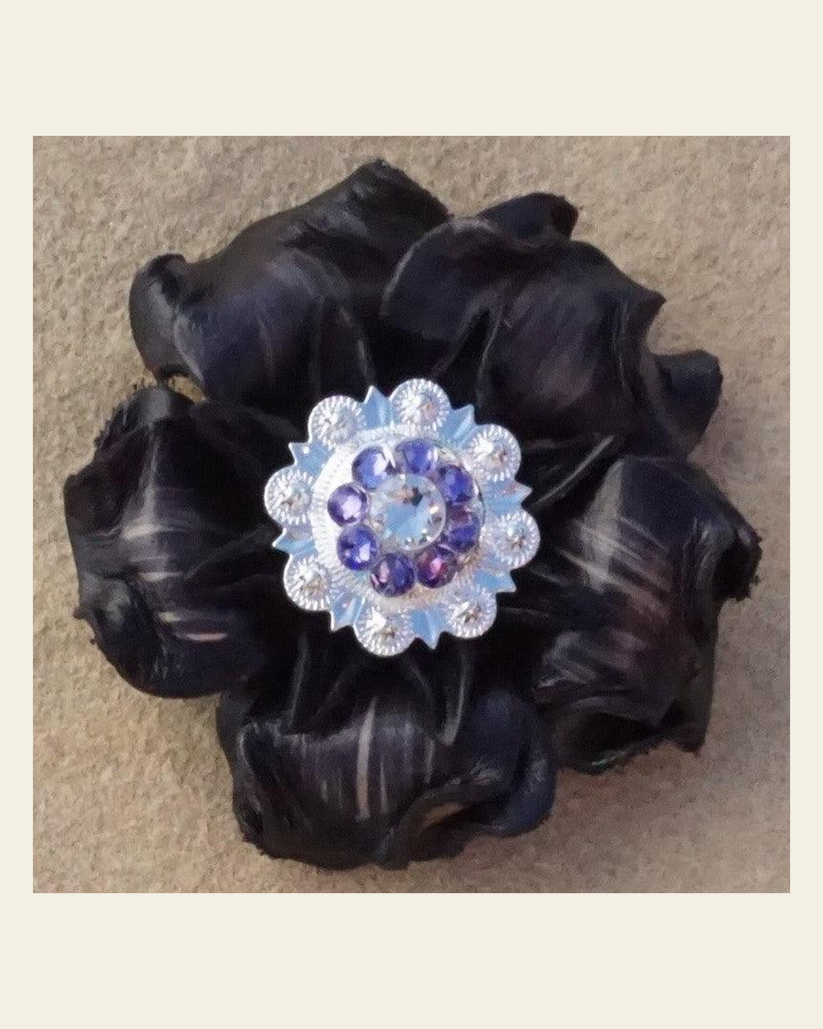 Black Gardenia Flower With Bright Silver Lilac and Clear 1" Concho on a warm cream background