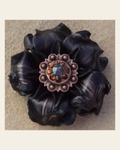 Black Gardenia Flower With Copper Black & Topaz 1" Concho on a warm cream background