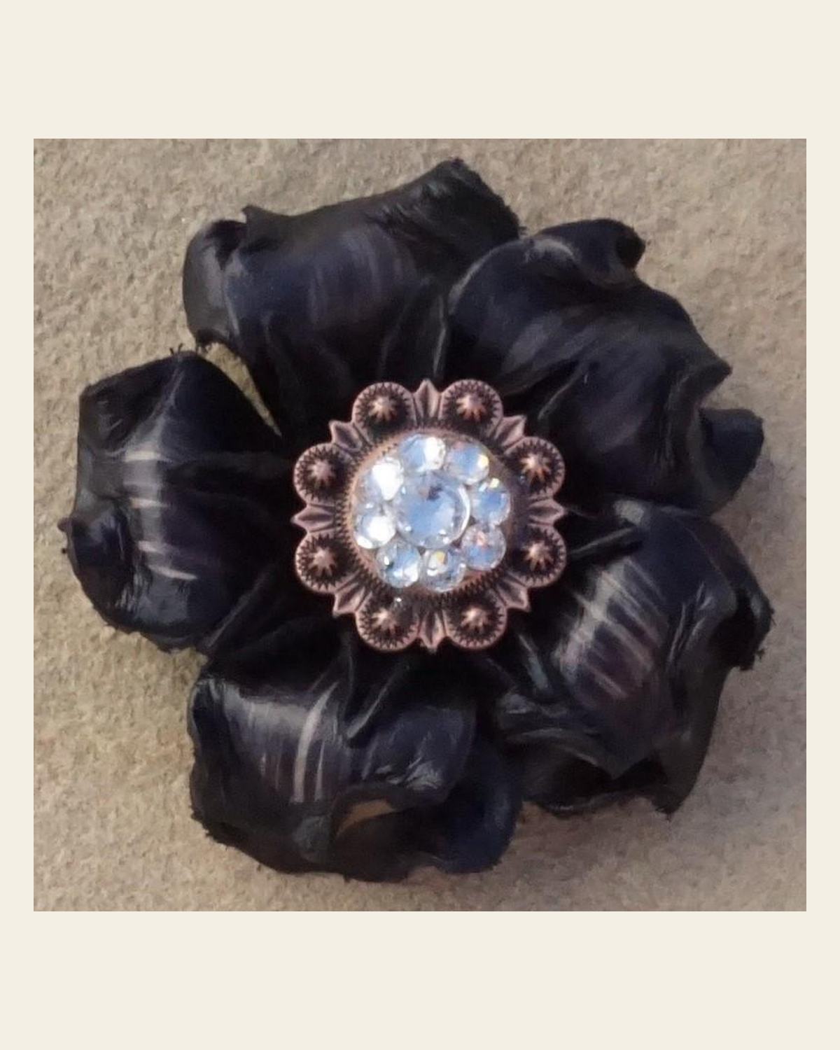 Black Gardenia Flower With Copper Clear 1" Concho on a warm cream background