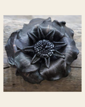 Black Gardenia Leather Flower on a warm cream background
