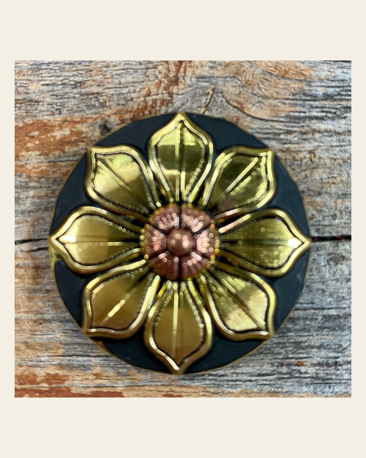 Black & Gold Sunflower Concho 1.5" W125L on a warm cream background