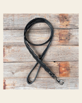 Black Genuine Leather leash 4' x 1" wide on a warm cream background