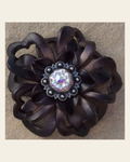 Black Lotus Flower With Antique Silver AB 1" Concho on a warm cream background