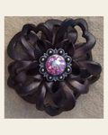 Black Lotus Flower With Antique Silver Pink and AB 1" Concho on a warm cream background
