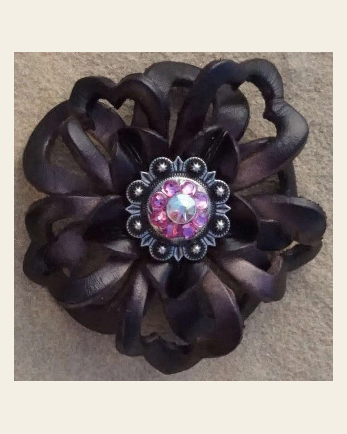 Black Lotus Flower With Antique Silver Pink and AB 1" Concho on a warm cream background