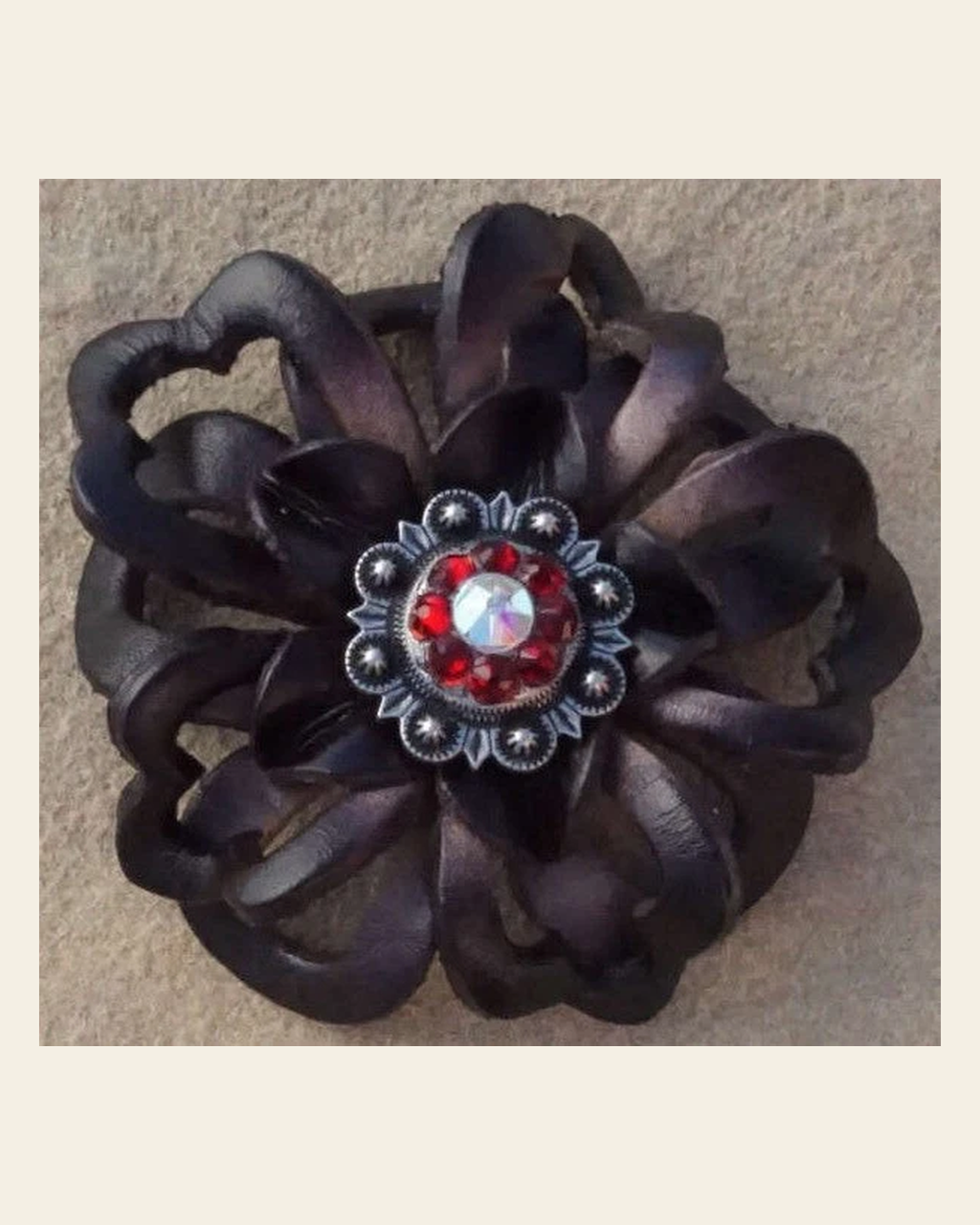 Black Lotus Flower With Antique Silver Ruby and AB 1" Concho on a warm cream background