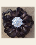 Black Lotus Flower With Bright Silver Clear 1" Concho on a warm cream background