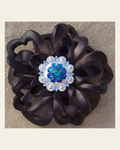 Black Lotus Flower With Bright Silver Teal and Capri 1" Concho on a warm cream background