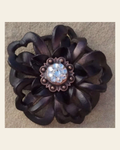Black Lotus Flower With Copper Clear 1" Concho on a warm cream background