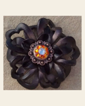 Black Lotus Flower With Copper Fire Opal and AB 1" Concho on a warm cream background