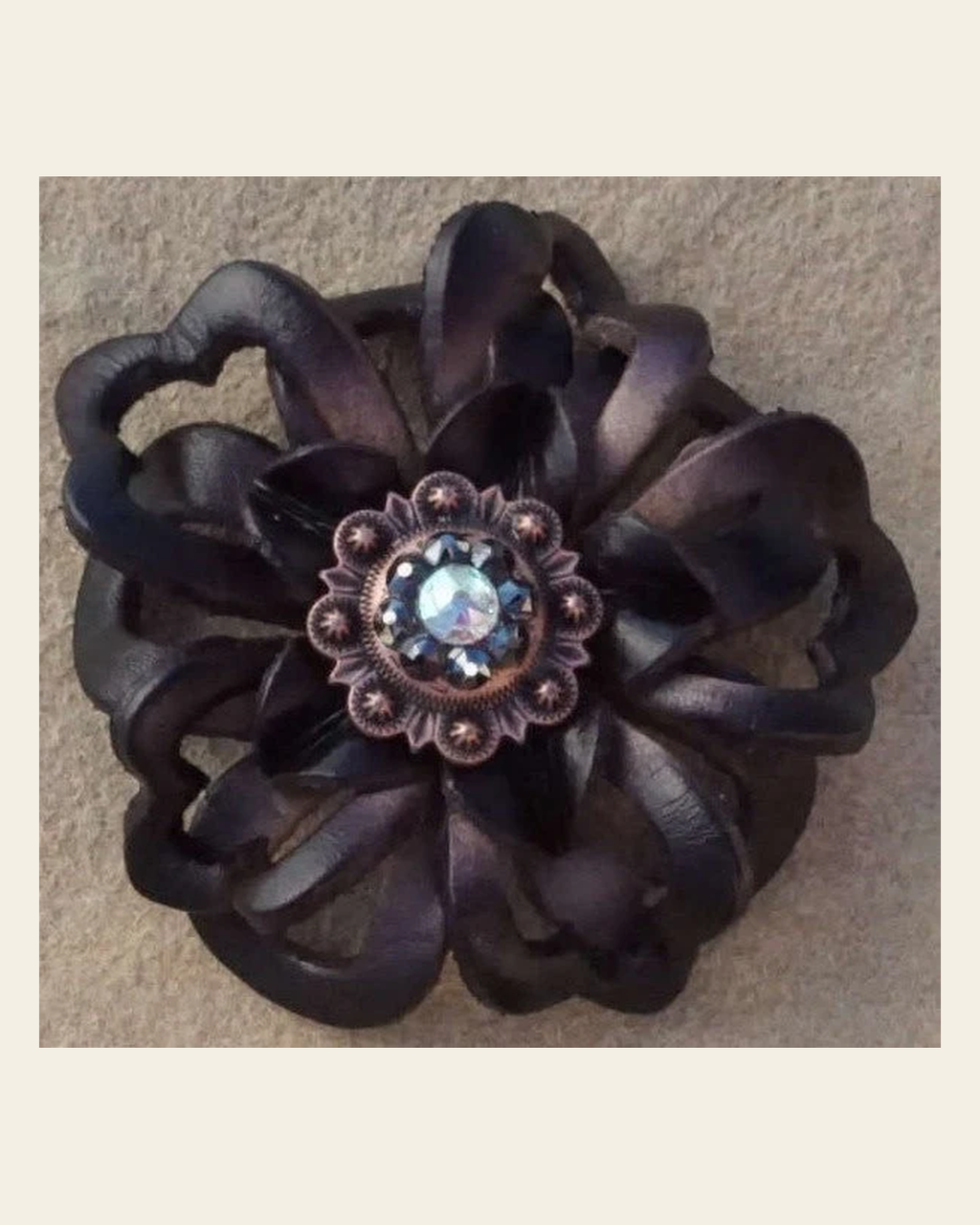 Black Lotus Flower With Copper Jet and AB 1" Concho on a warm cream background