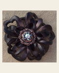 Black Lotus Flower With Copper Jet and AB 1" Concho on a warm cream background