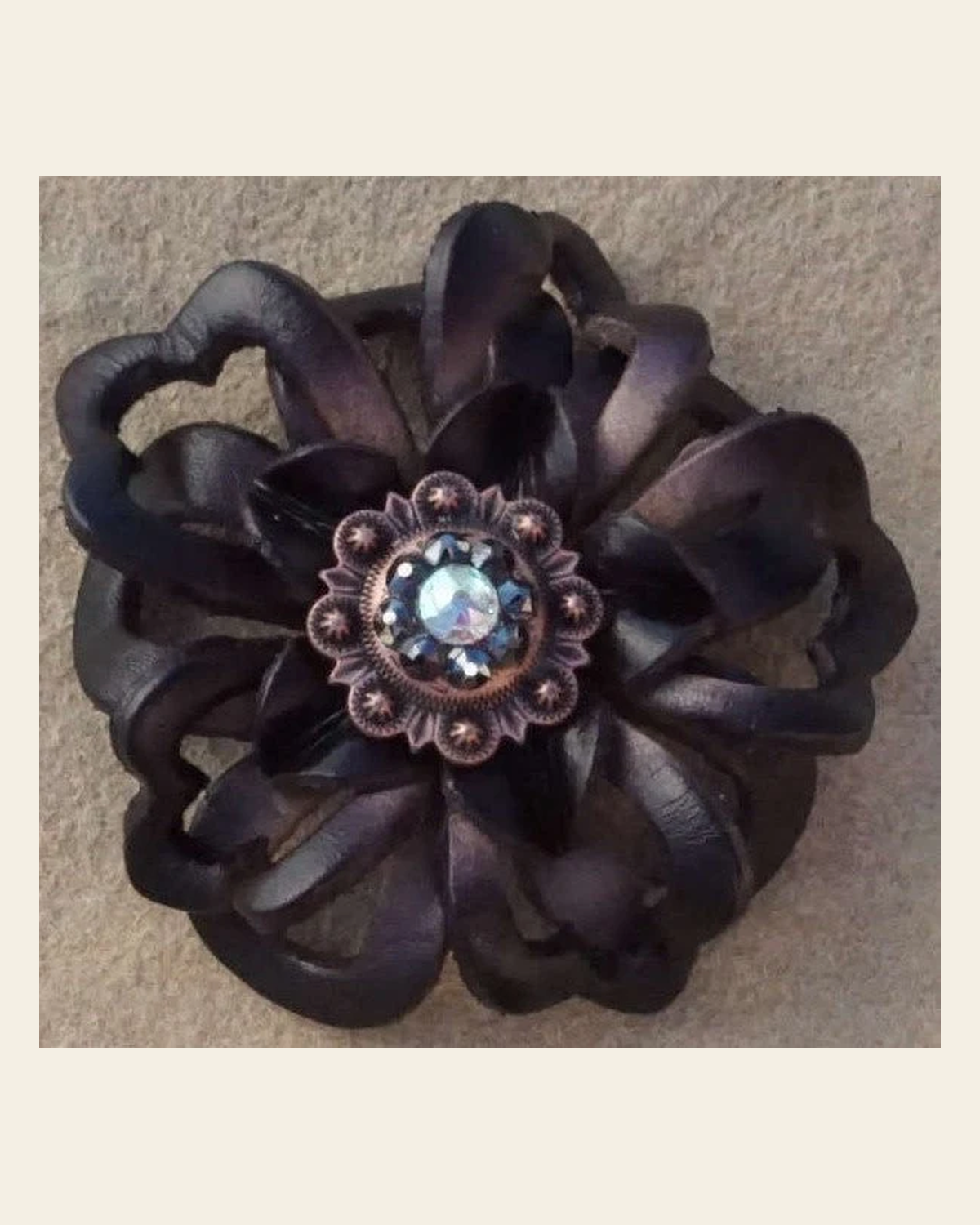 Black Lotus Flower With Copper Jet and AB 1" Concho on a warm cream background