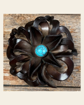 Black Lotus Flower With Round Turquoise Cabochon on a warm cream background