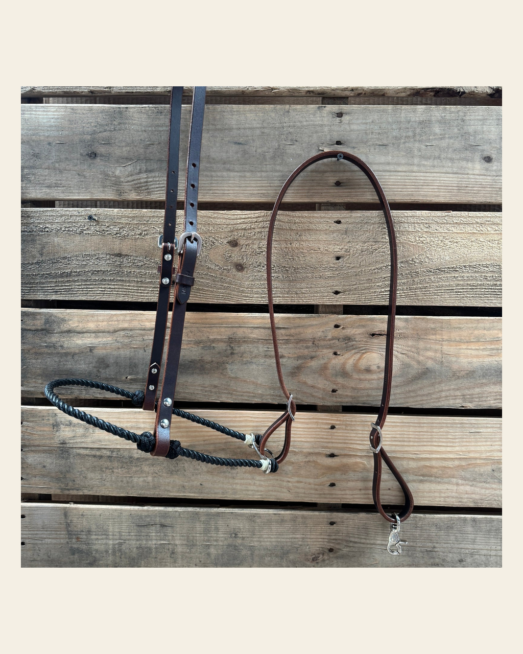 Black Single Rope Noseband Lariat with Leather Hanger #HAN107 on a warm cream background