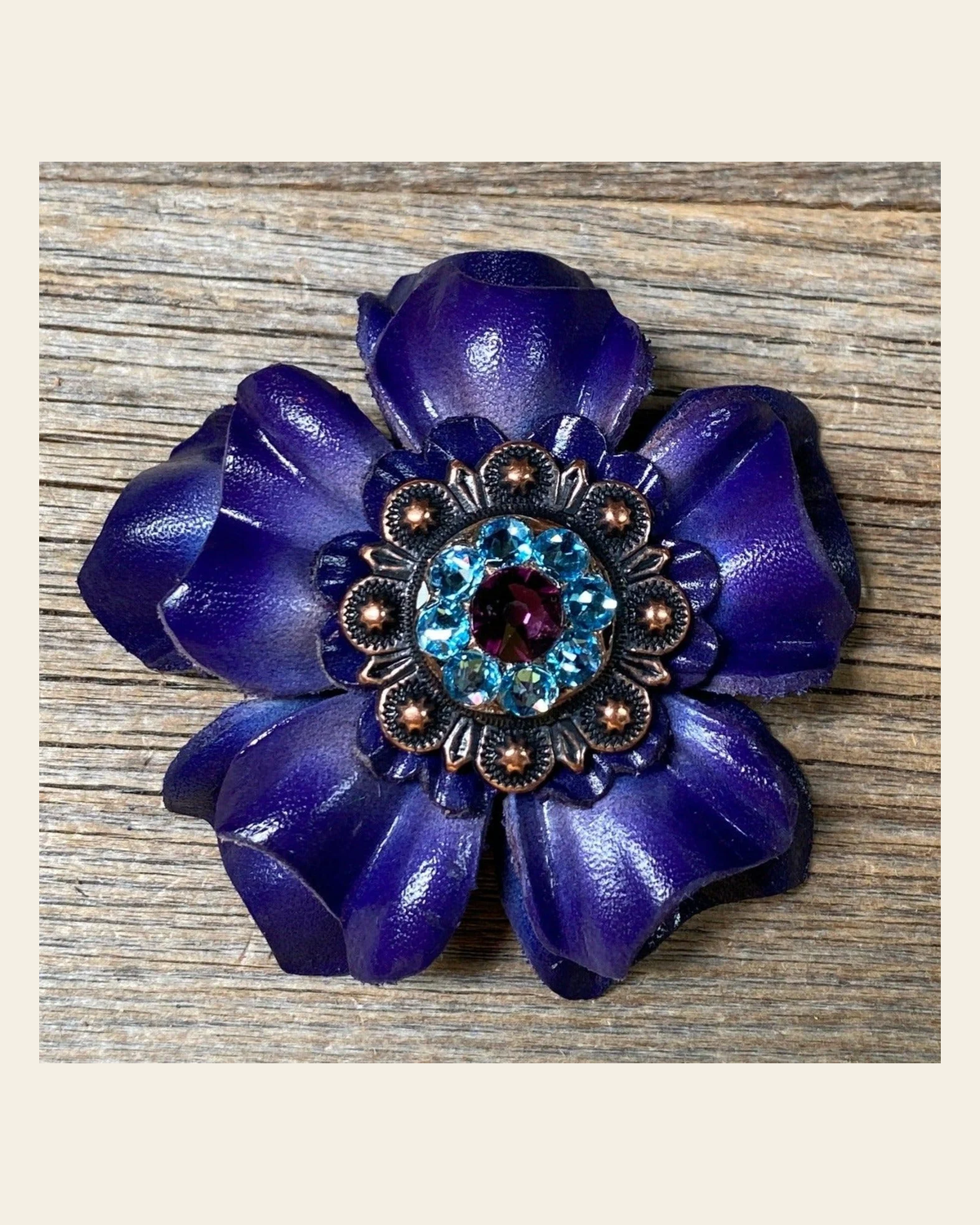 Blue Carnation Flower With Copper Amethyst & Aqua 1" Concho on a warm cream background