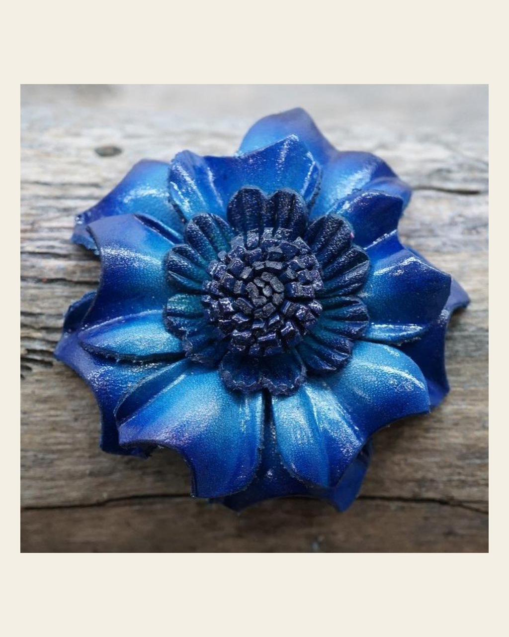 Blue Carnation Leather Flower on a warm cream background