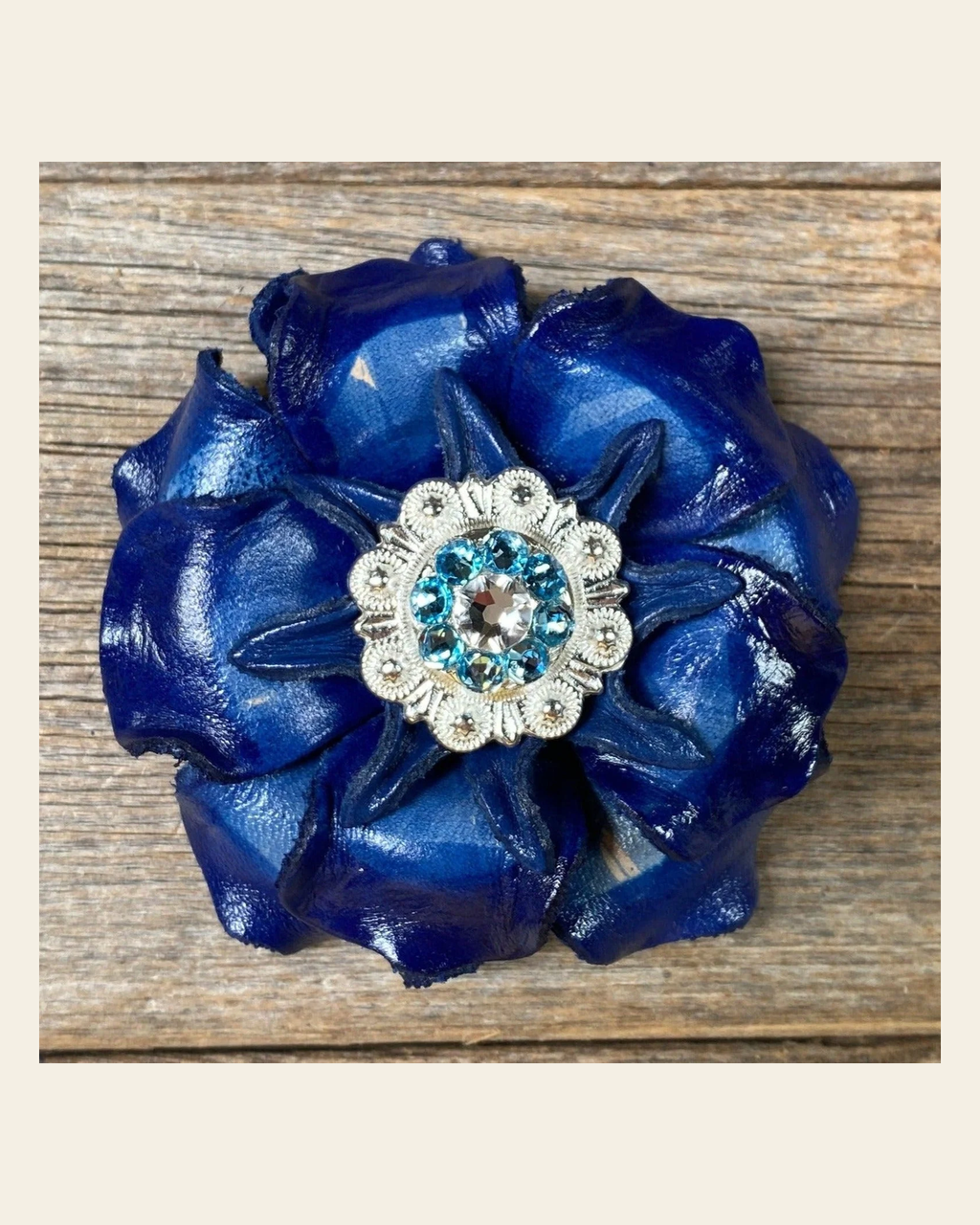 Blue Gardenia Flower With Bright Silver Aqua & Clear 1" Concho on a warm cream background