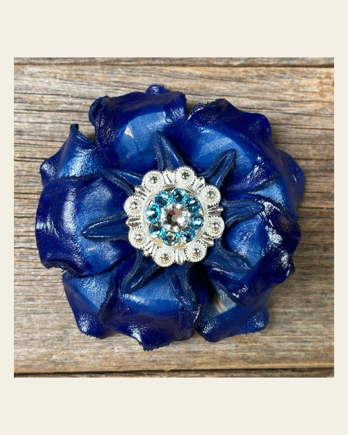 Blue Gardenia Flower With Bright Silver Aqua & Clear 1" Concho on a warm cream background