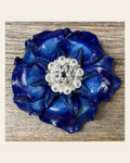 Blue Gardenia Flower With Bright Silver Clear 1" Concho on a warm cream background