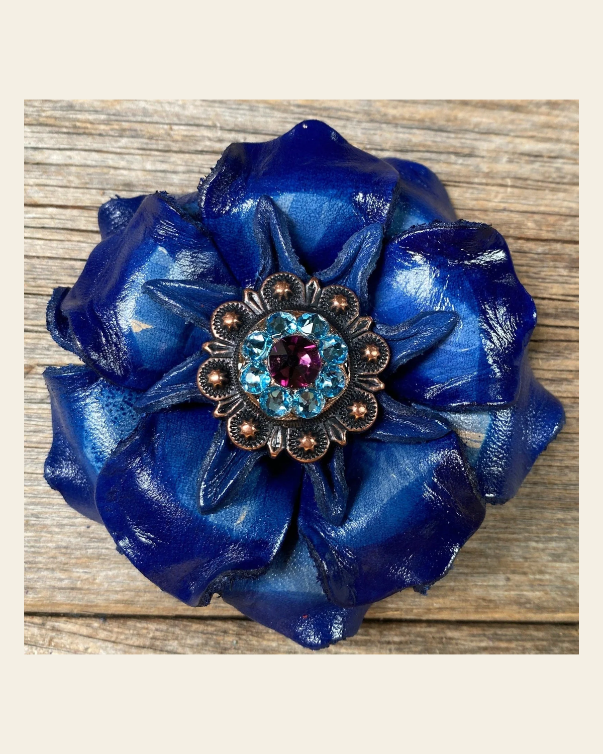 Blue Gardenia Flower With Copper Amethyst & Aqua 1" Concho on a warm cream background