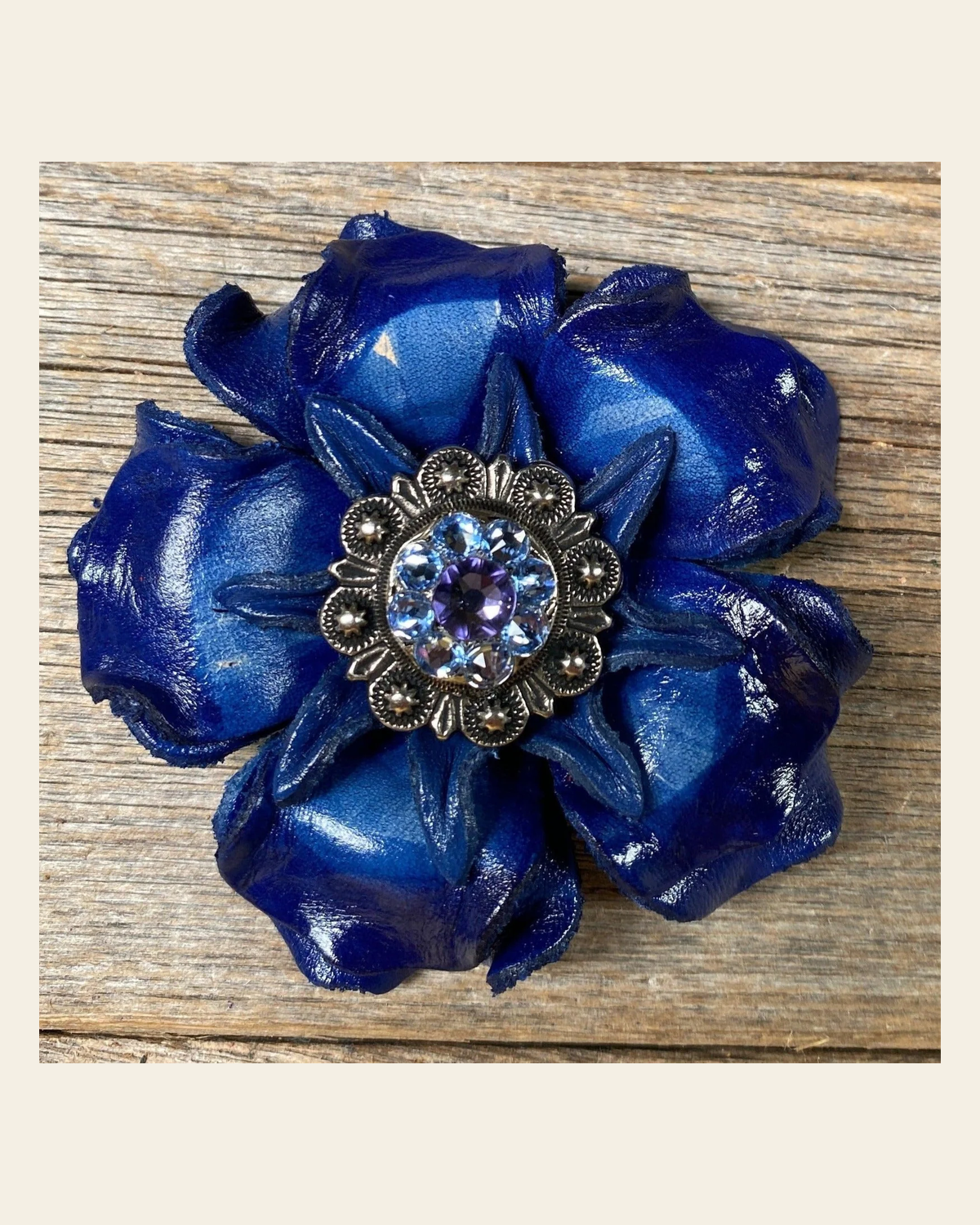 Blue Gardenia Flower - Antique Silver Lilac & Light Sapphire 1" Concho on a warm cream background