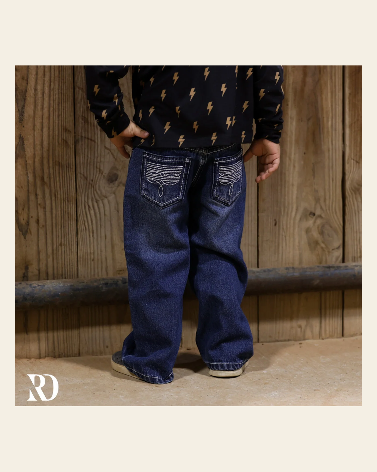 Bam Bootcut - Dark Wash Toddler Boy Denim on a warm cream background