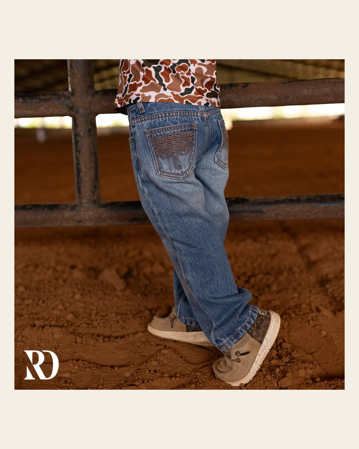 Bam Bootcut - Medium Wash Toddler Boy Denim on a warm cream background