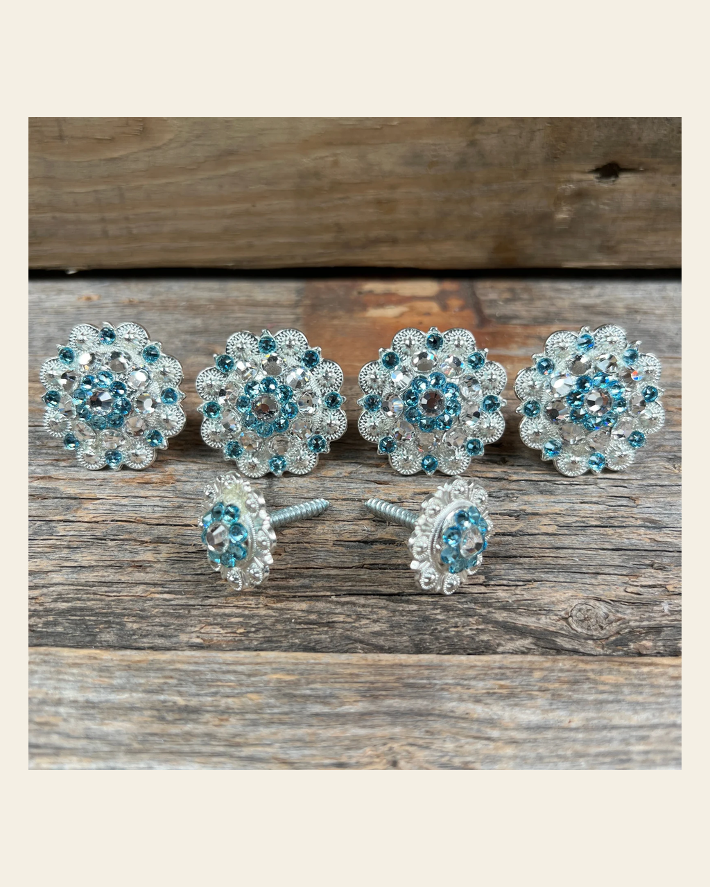 Bright Silver Aqua & Clear Saddle Conchos on a warm cream background