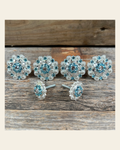 Bright Silver Aqua & Clear Saddle Conchos on a warm cream background