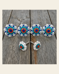 Bright Silver Capri Fire Opal & Teal Saddle Conchos on a warm cream background