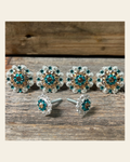 Bright Silver Champagne & Teal Saddle Conchos on a warm cream background