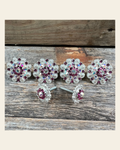 Bright Silver Fuchsia & AB Saddle Conchos on a warm cream background