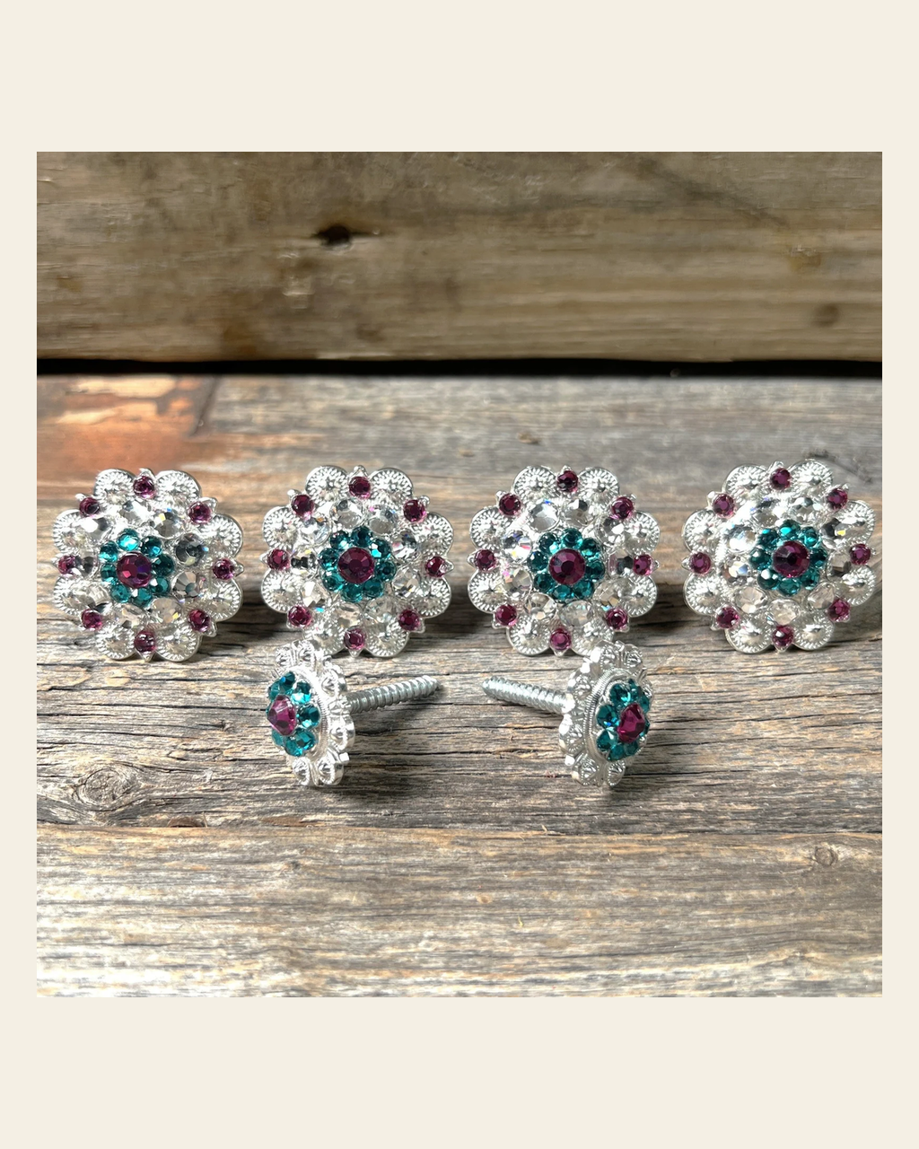Bright Silver Fuchsia Teal & Clear Saddle Conchos on a warm cream background