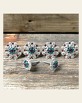 Bright Silver Fuchsia Teal & Clear Saddle Conchos on a warm cream background