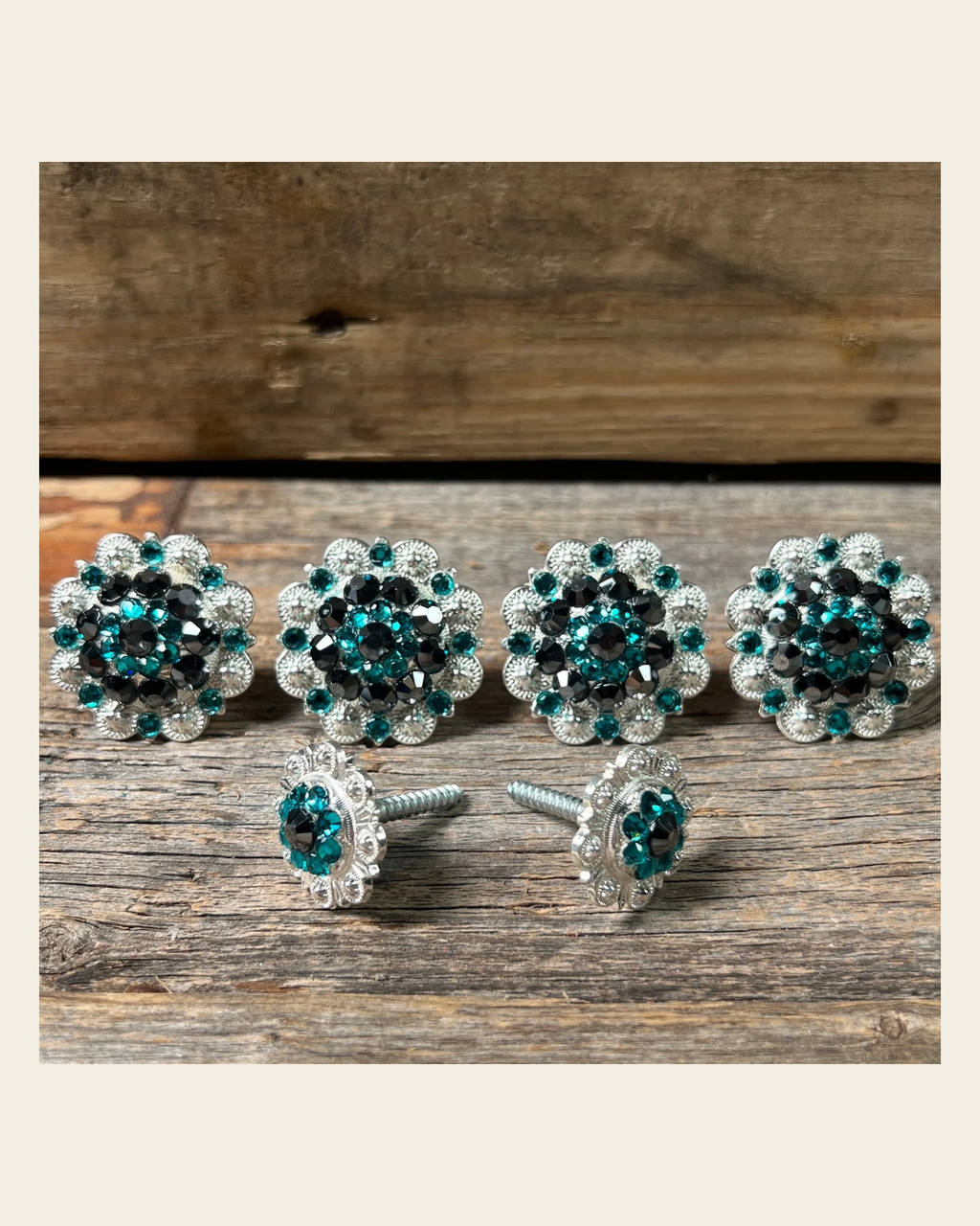 Bright Silver Jet & Teal Saddle Conchos on a warm cream background
