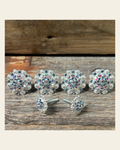 Bright Silver Light Sapphire & AB Saddle Conchos on a warm cream background