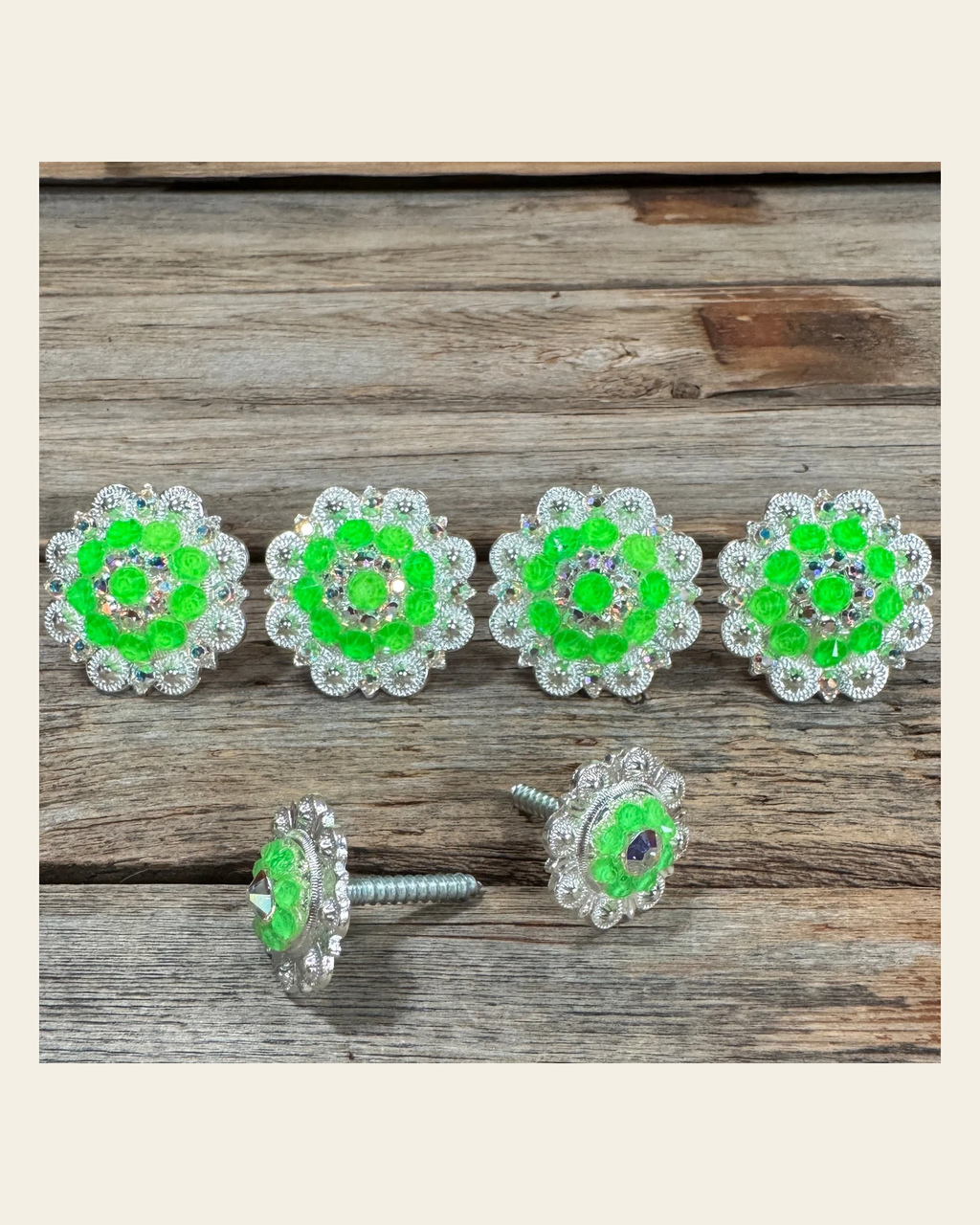 Bright Silver Neon Green & AB Saddle Conchos on a warm cream background