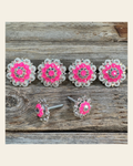 Bright Silver Neon Pink & AB Saddle Conchos on a warm cream background