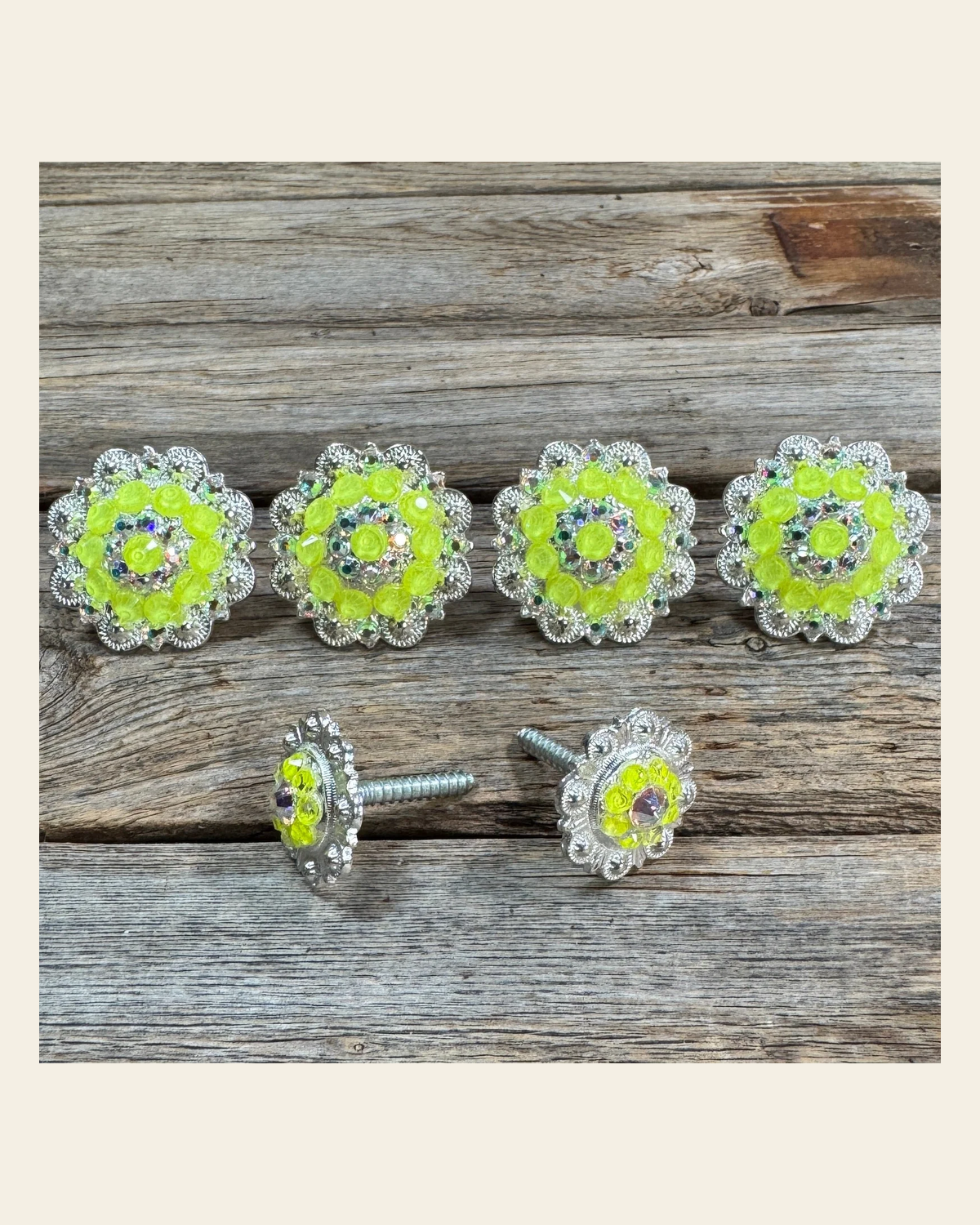 Bright Silver Neon Yellow & AB Saddle Conchos on a warm cream background
