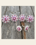 Bright Silver Pink & AB Saddle Conchos on a warm cream background