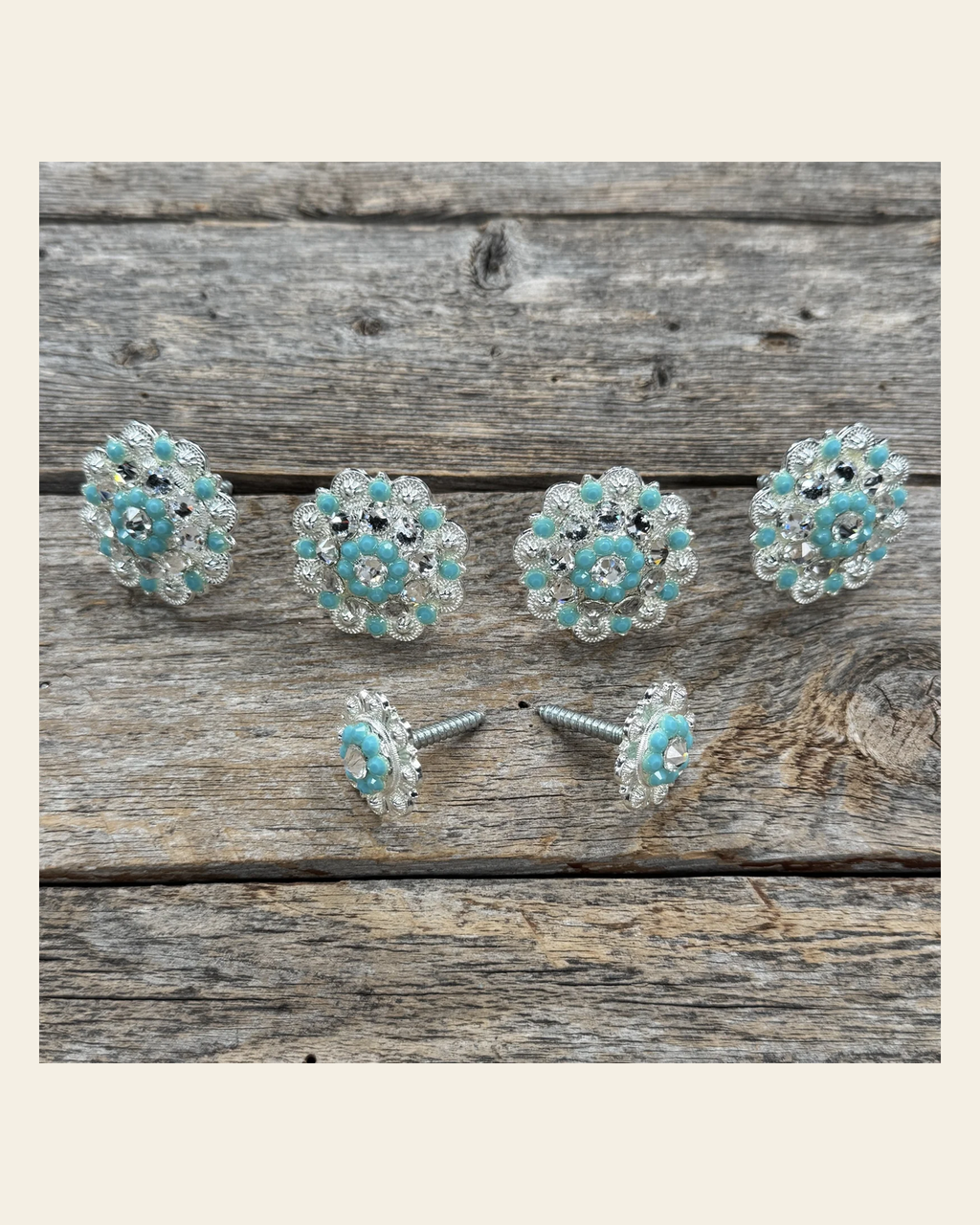 Bright Silver Turquoise & Clear Saddle Conchos on a warm cream background