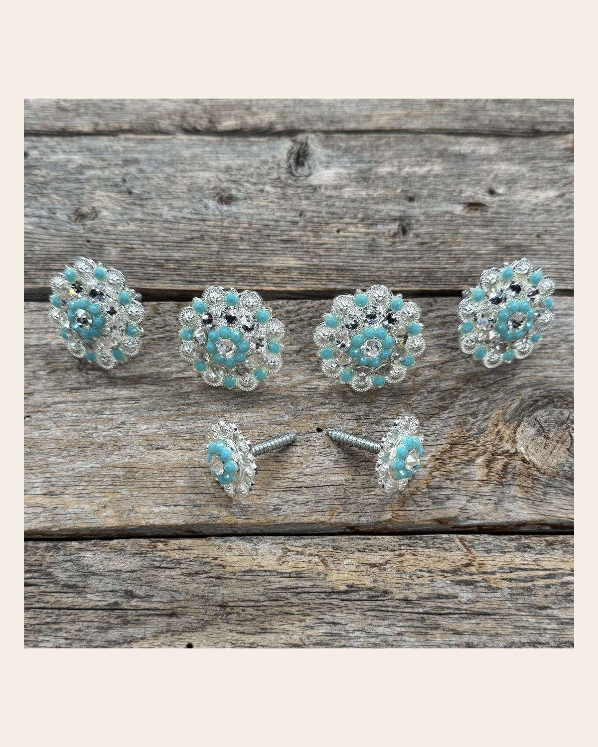 Bright Silver Turquoise & Clear Saddle Conchos on a warm cream background