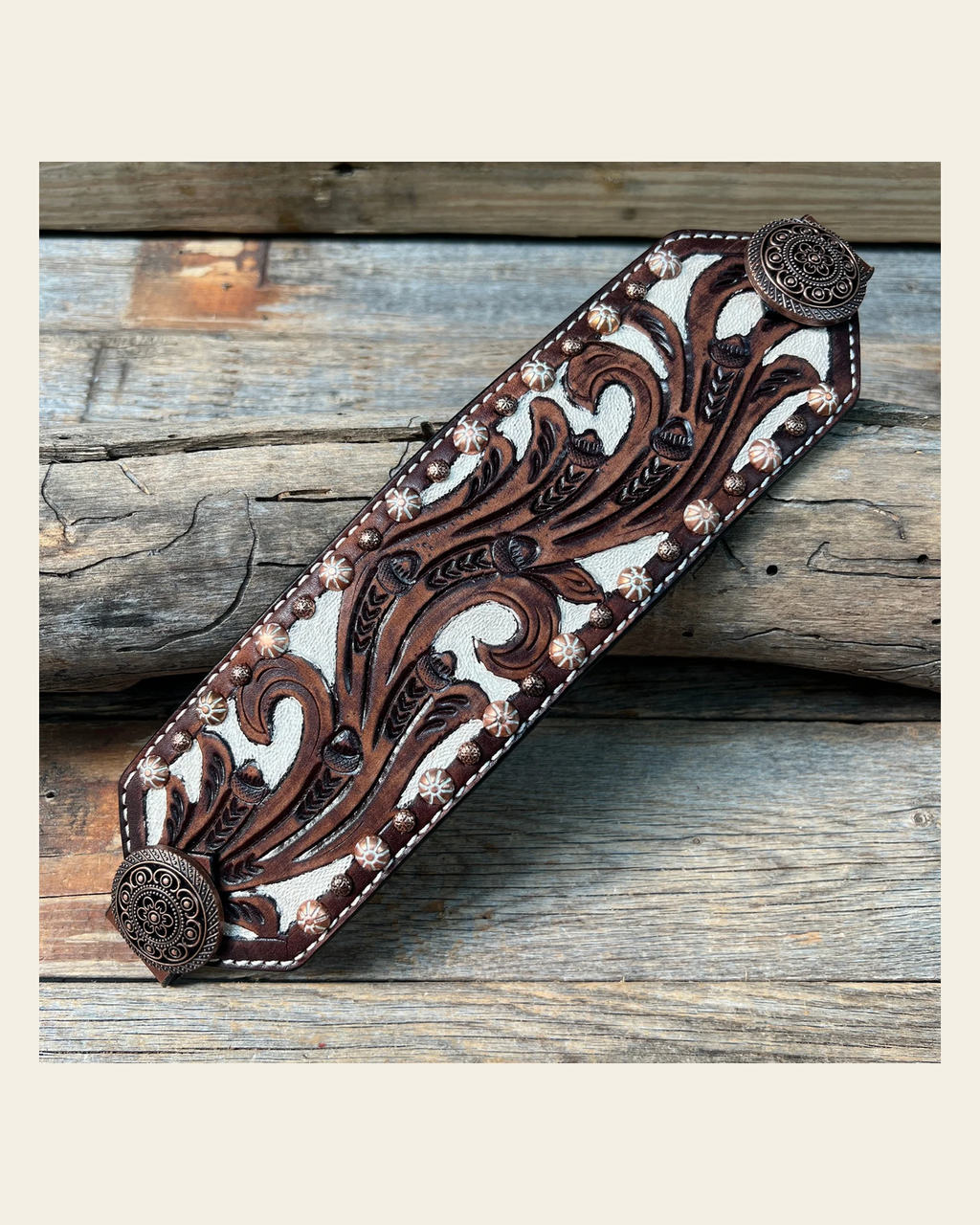 Bronc Noseband With Copper Intricate Engraved Western Conchos on a warm cream background