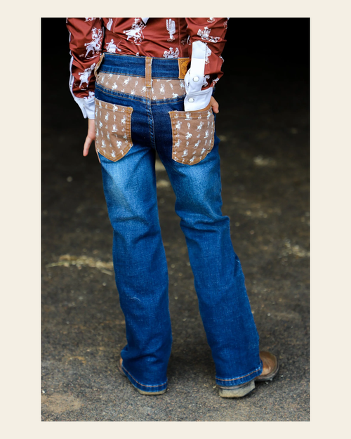*youth* Buckaroo Bootcut Denim Jeans on a warm cream background