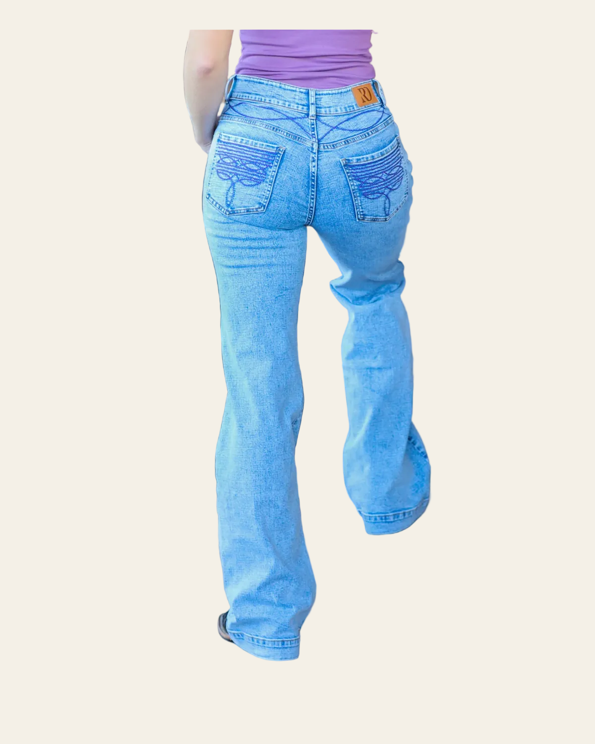 Cheyenne Trousers Acid Wash Purple Pocket on a warm cream background